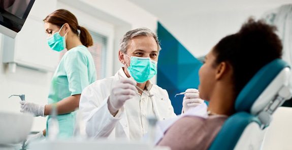 Dentist treats patient