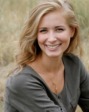 Woman sharing beautiful smile after Chao Pinhole Surgical Technique