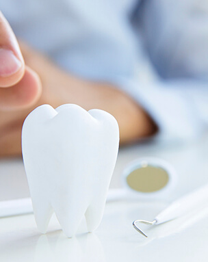 Tooth and dental tools representing periodontal services in Encinitas